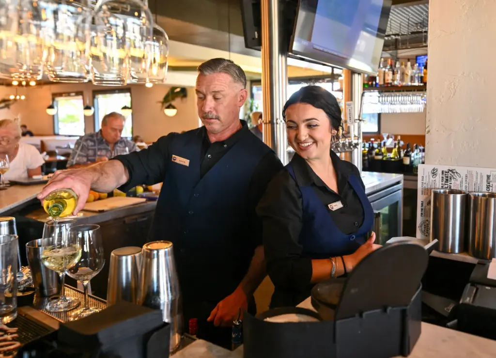 Aaron Larragoitiy and Rhe Wilburn serve up drinks at Market...