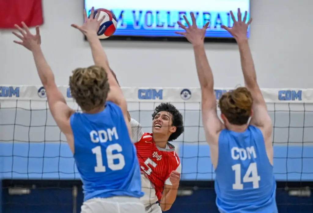 Mater Deiâs Deakon Cortes hits the ball through Corona del...
