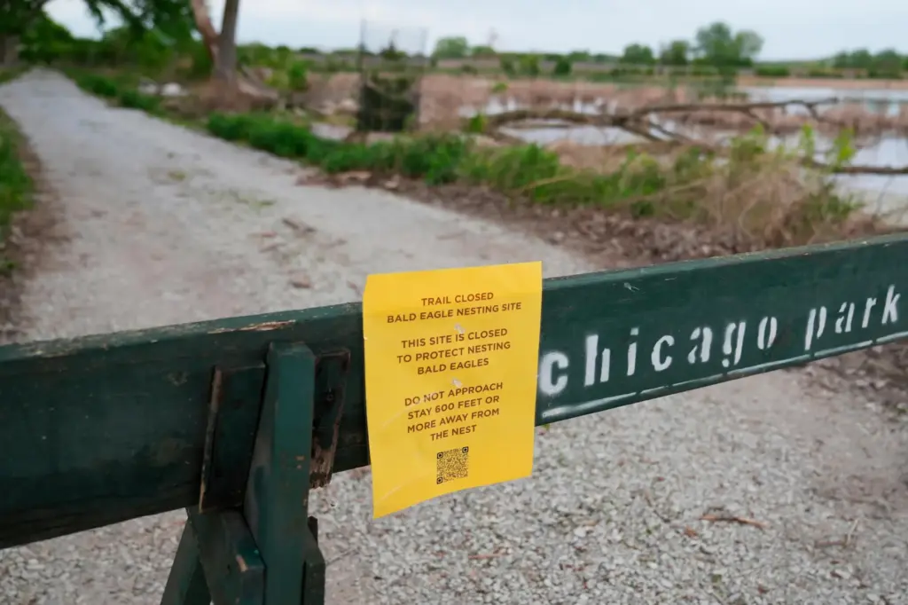 A trail closed sign is posted near the site where...