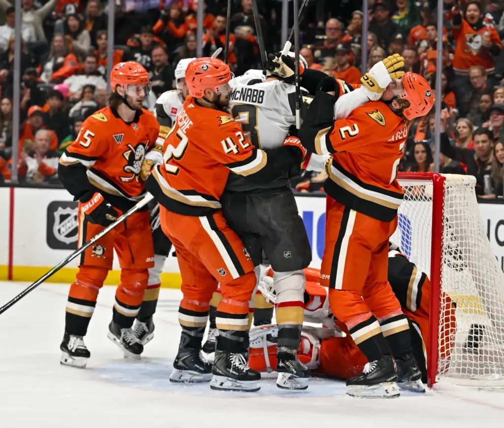 The Ducksâ Tim Washe (42) and Jackson LaCombe (2) get...