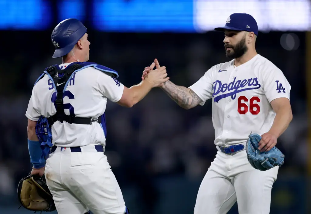 Dodgers relief pitcher Tanner Scott, right, celebrates with catcher Will...