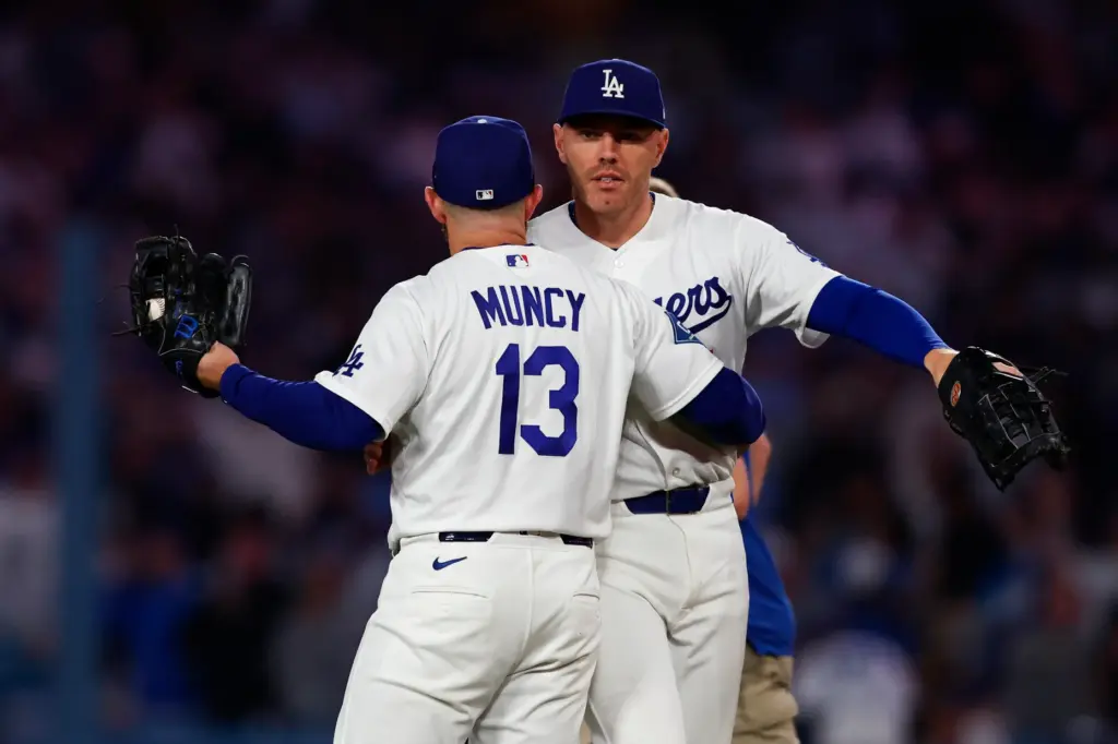 Dodgers first baseman Freddie Freeman, back, and third baseman Max...