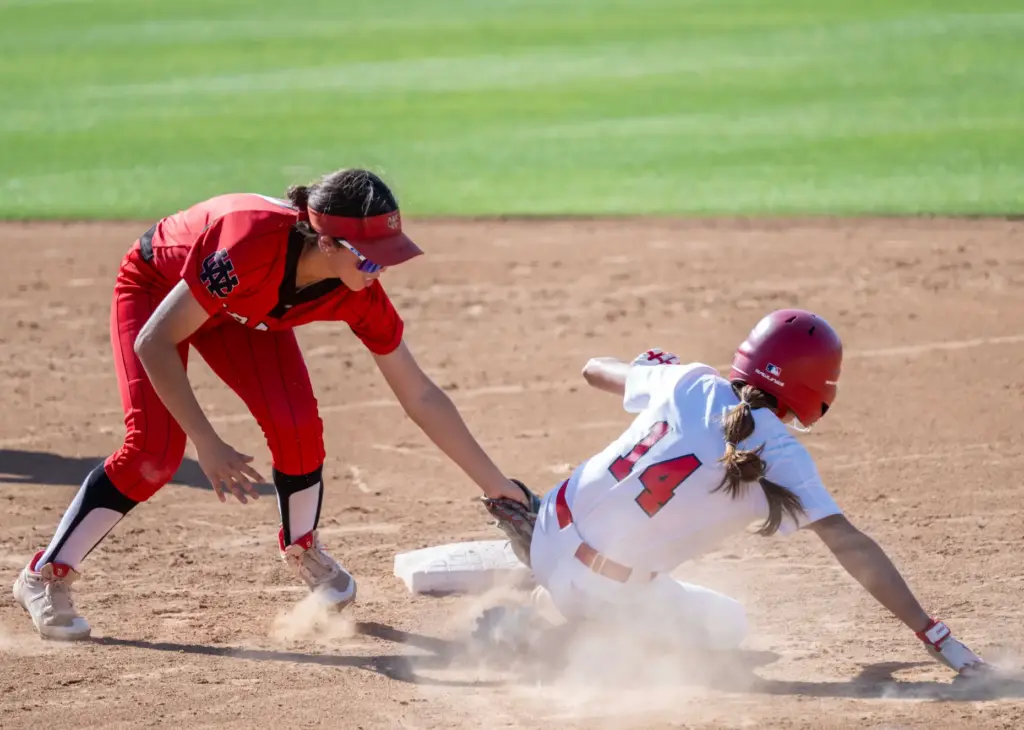 Whittier Christian second baseman Rylee Cull, left, tags out Mater...