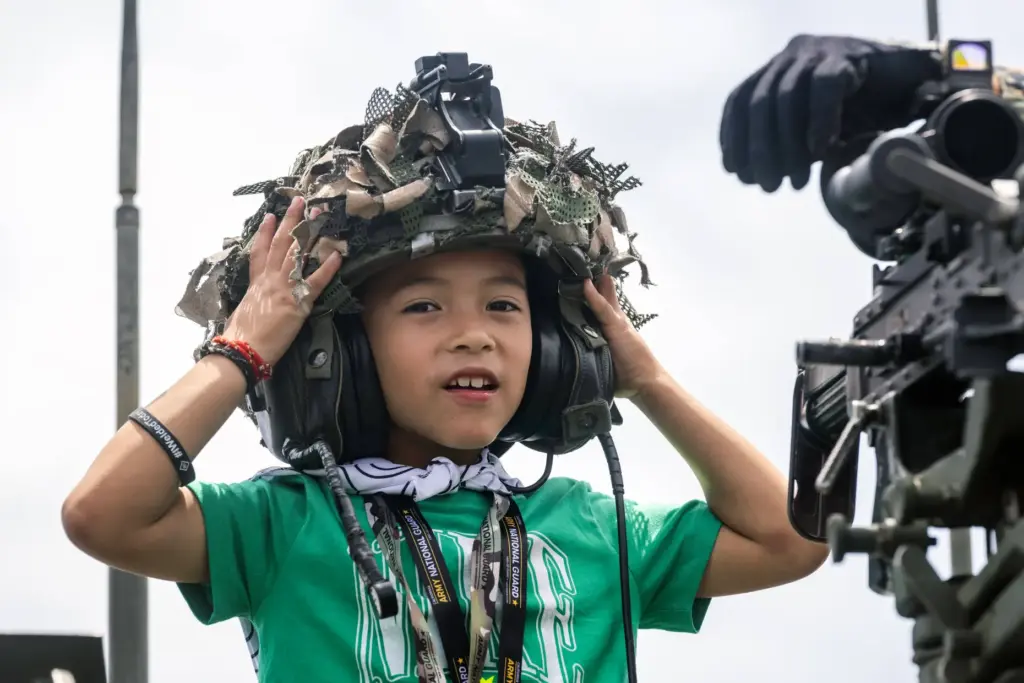 Six-year-old Mattson Marsteller tries on a CVC helmet during day...