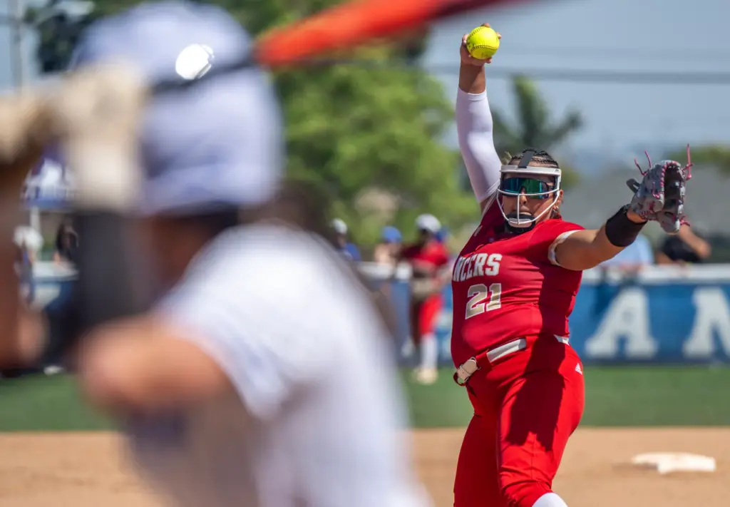 Orange Lutheran starting pitcher Rylee Silva throws to home plate...
