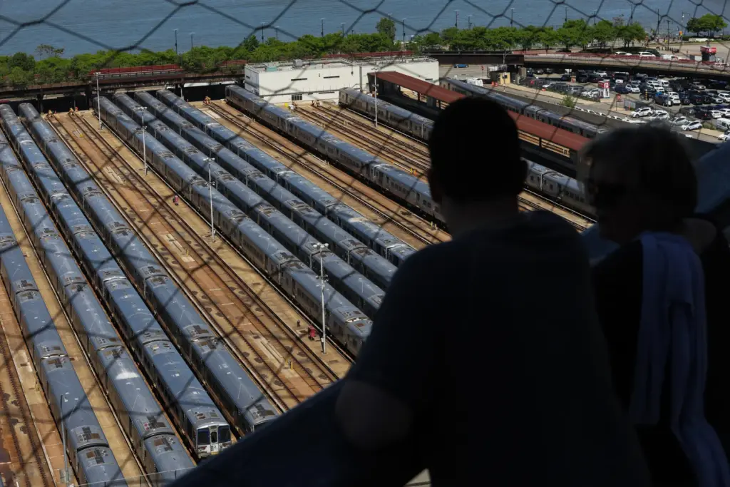 Visitors look out at the trains at the West Side Yard from the Vessel.