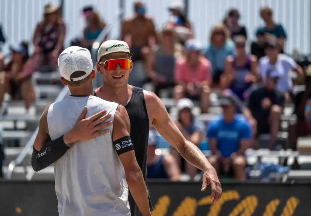 Teammates Miles Partain, left, and James Shaw celebrate their straight-sets...