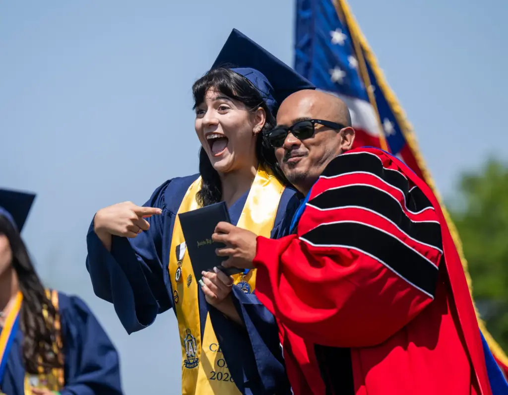 Shilah Escobosa, left, has some fun as she receives her...
