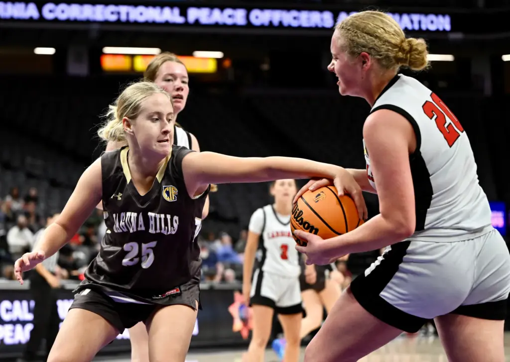 Meghan Rehmeier #25 of Laguna Hills reaches for the ball...