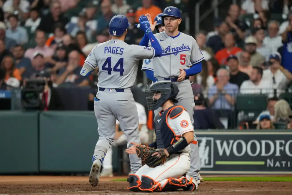 The Dodgers’ Andy Pages (44) celebrates with first baseman Freddie...