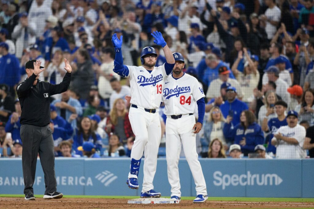The Dodgers’ Max Muncy, center, celebrates his RBI single at...