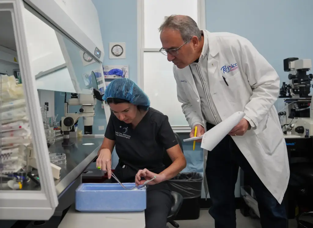 Sarah Atkinson and Dr. John Gordon verify patient information.