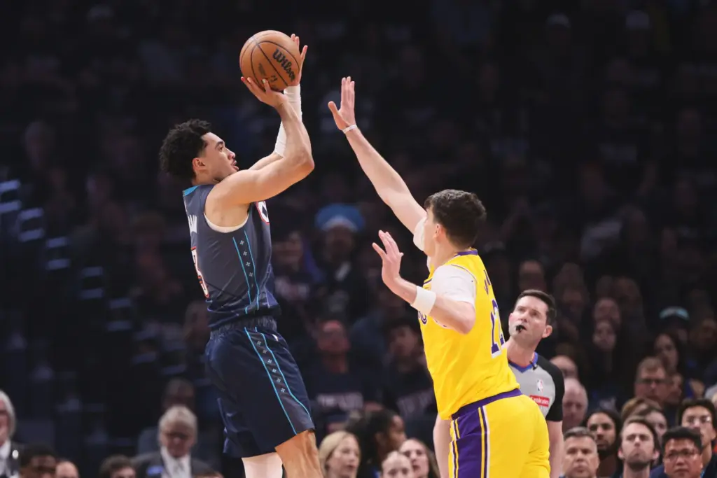 Oklahoma City Thunder’s Jared McCain, left, shoots over Los Angeles...
