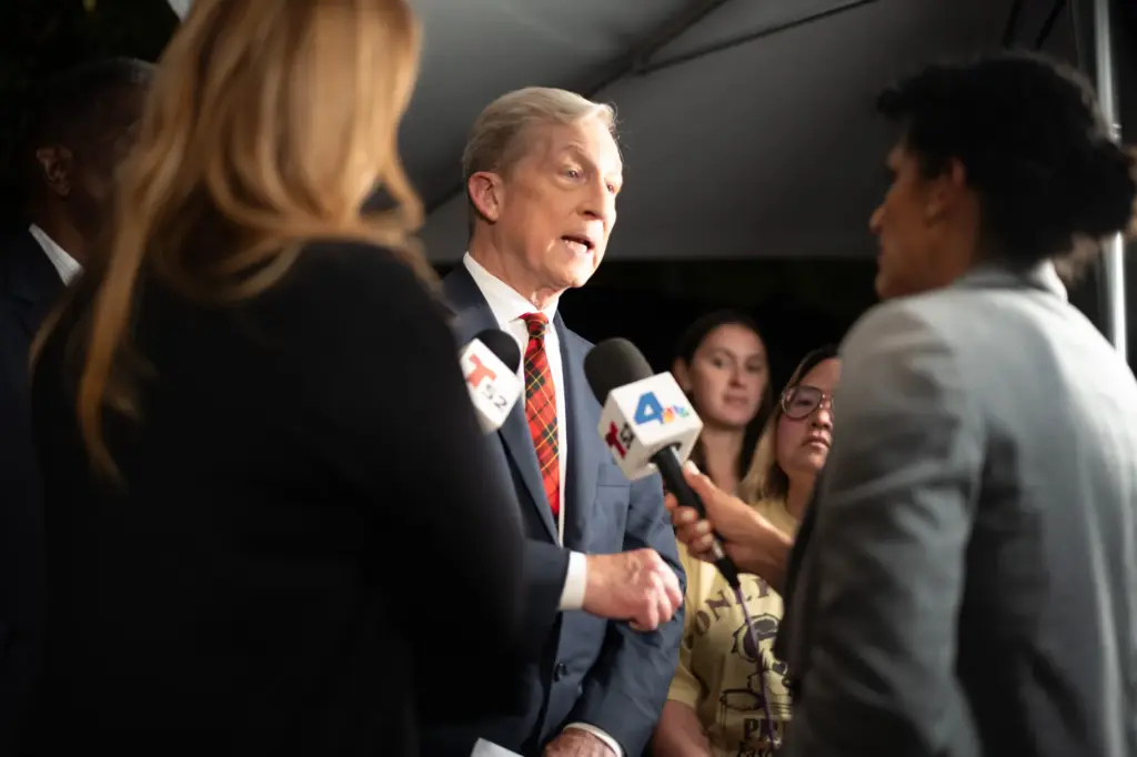 Gubernatorial candidate Tom Steyer talks with media after a debate...