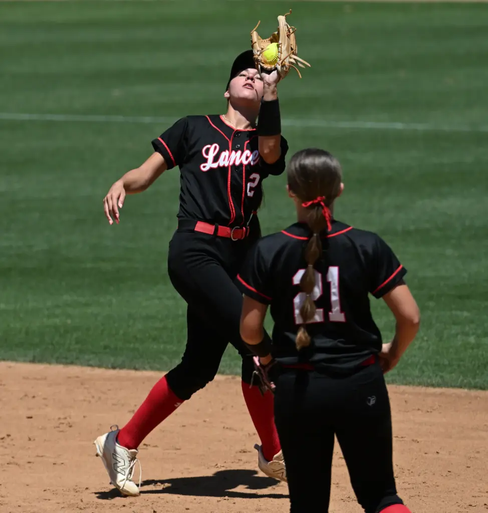 Grace Highâs shortstop Grace Maguire (2) catches the ball to...