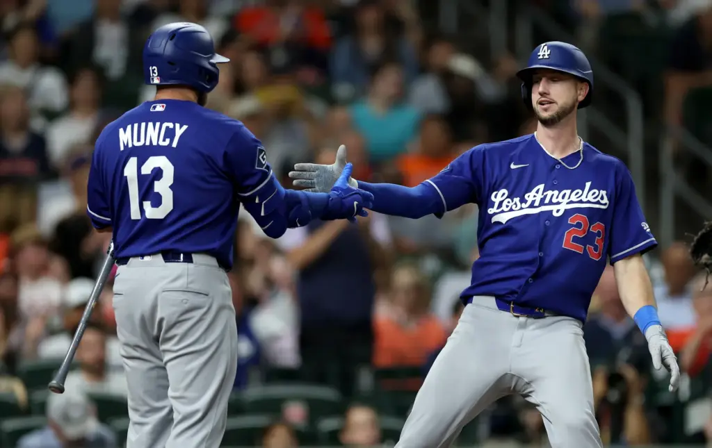 The Dodgers’ Kyle Tucker, right, is congratulated by teammate Max...