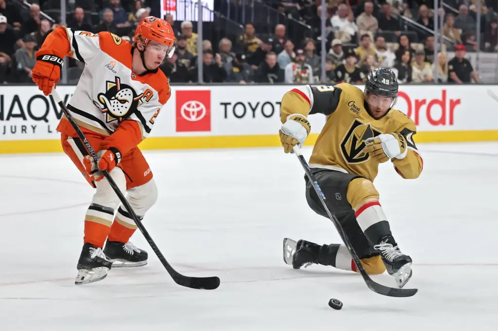 The Vegas Golden Knights’ Ivan Barbashev, right, collects the puck...