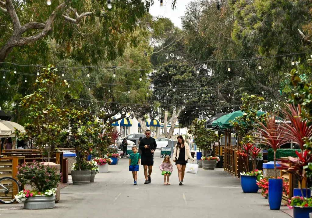 Sarah YeldellÂ and her husbad, ClayÂ Yeldell, walk with up Forest Avenue...