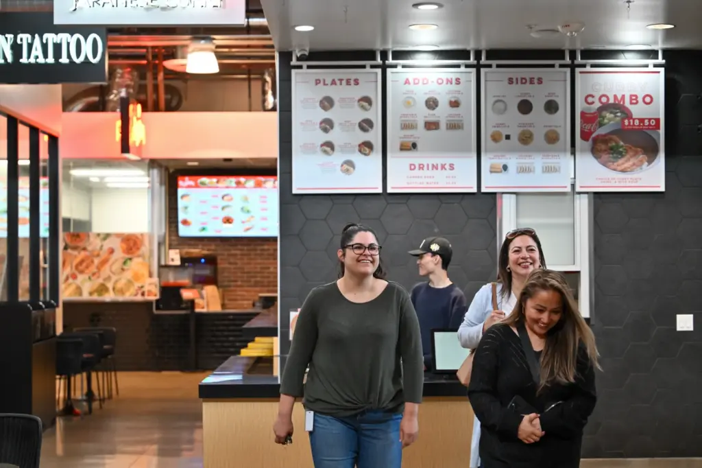 Visitors roam Rodeo 39 food hall during lunch in Stanton,...