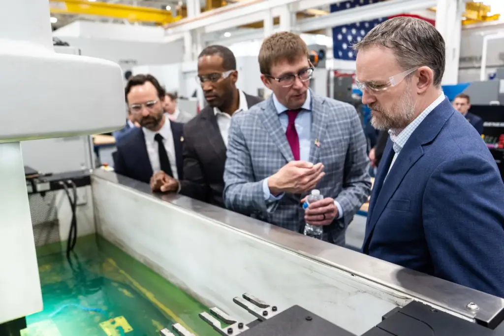 U.S. Trade Representative Jamieson Greer and Rep. John James tour the Atomic Industries' manufacturing facility.