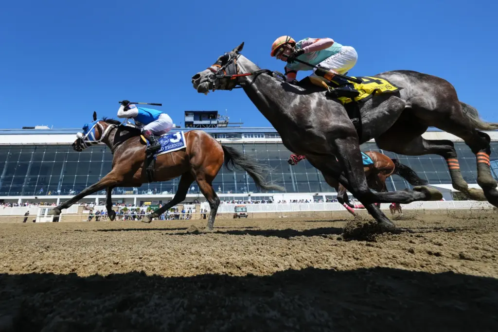 Jeiron Barbosa, left, atop Wickeddivine, edges out Irad Ortiz Jr.,...