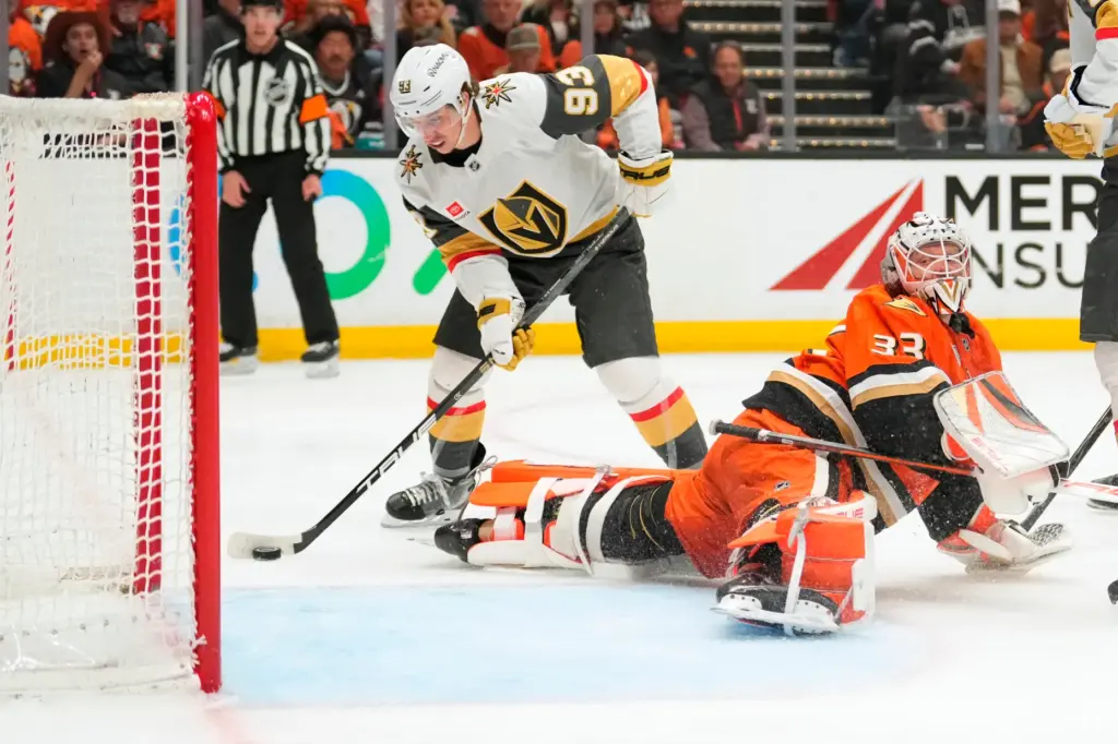 Vegas Golden Knights right wing Mitch Marner, left, scores on...