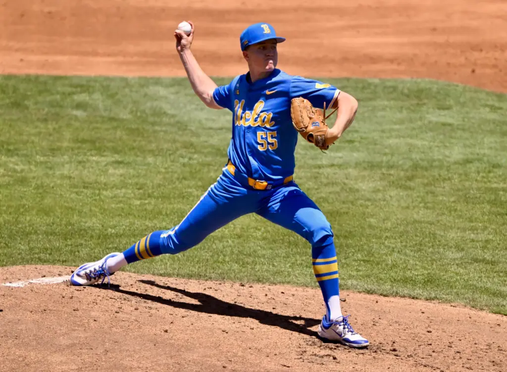 Starting pitcher Michael Barnett #55 of the UCLA Bruins throws...