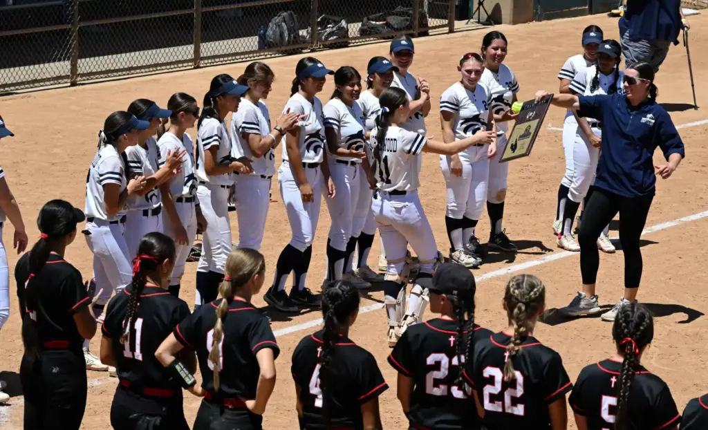 The Northwood High softball team celebrates receives their first place...