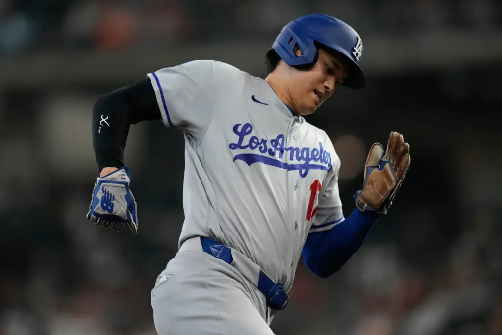 Dodgers star Shohei Ohtani rounds third during the fourth inning...