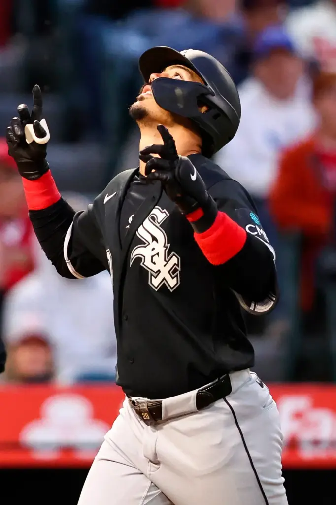 The Chicago White Sox’s Miguel Vargas gestures as he crosses...