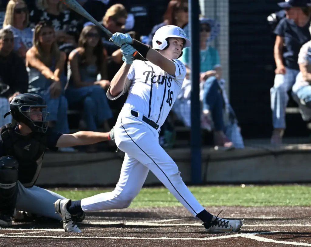 Henry Mann (18) of Newport Harbor hits a home-run against...