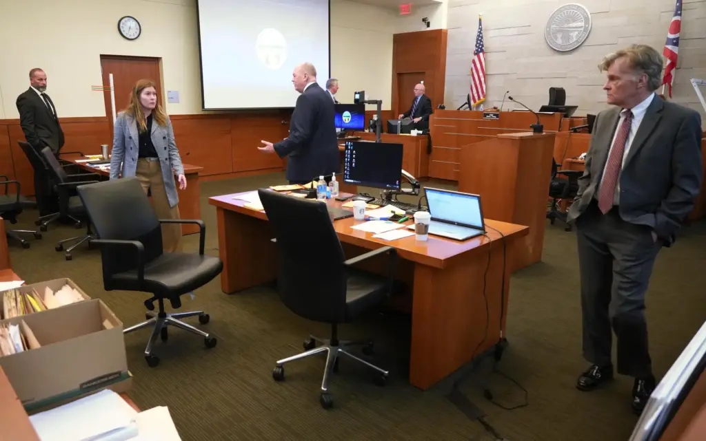 From left, former sheriff’s deputy Jason Meade, defense attorney Kaitlyn...