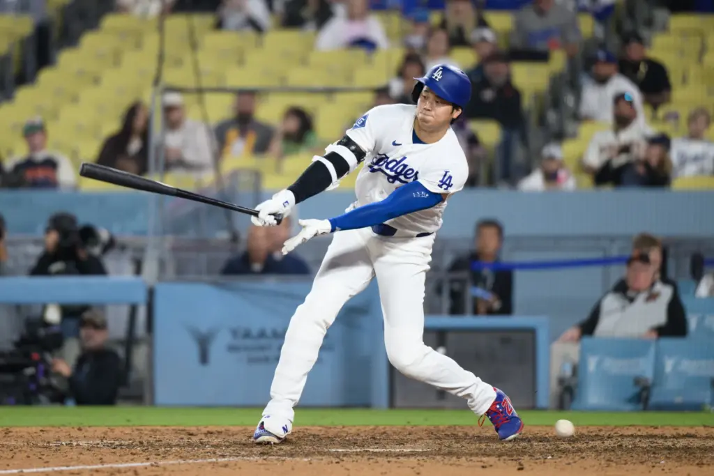 Dodgers star Shohei Ohtani strikes out swinging during the ninth...