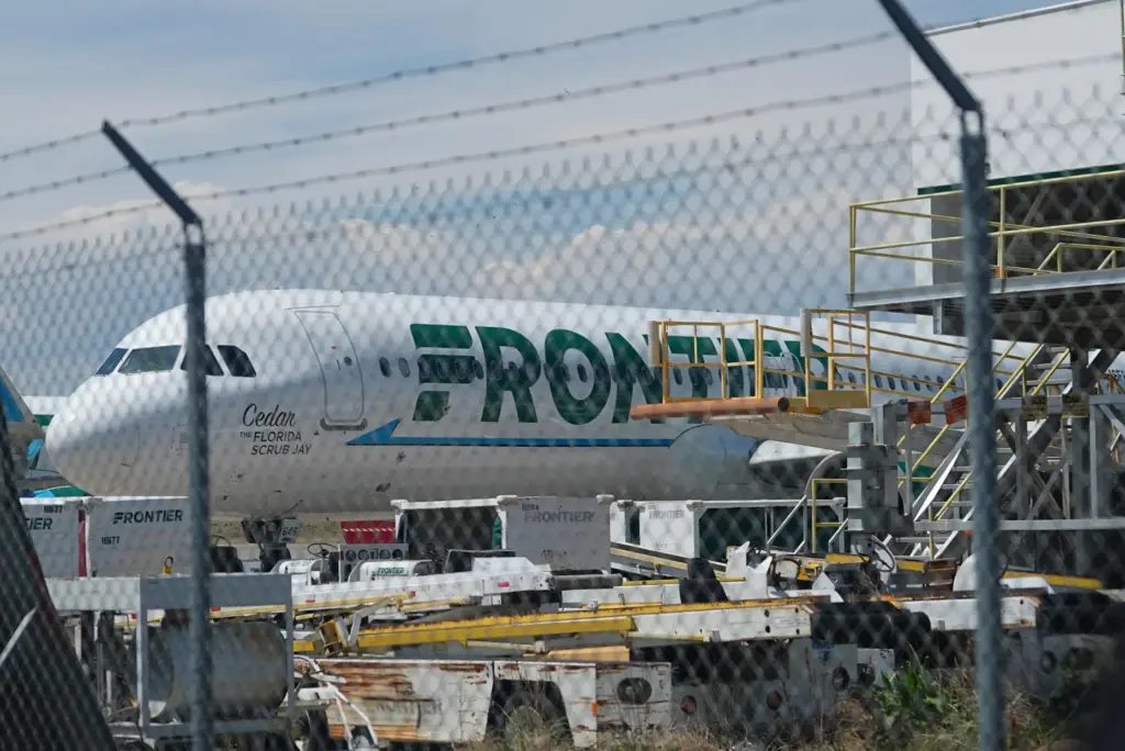 Frontier Airlines jetliner number n646fr sits outside the airlines technical...