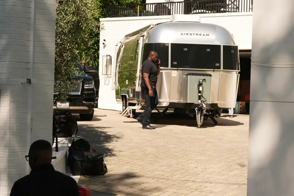 An Airstream is parked in the driveway to Rihanna’s residence...
