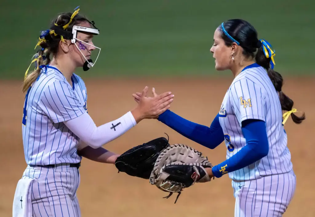 La Mirada pitcher Alison Ortega, left, and first baseman Juliana...
