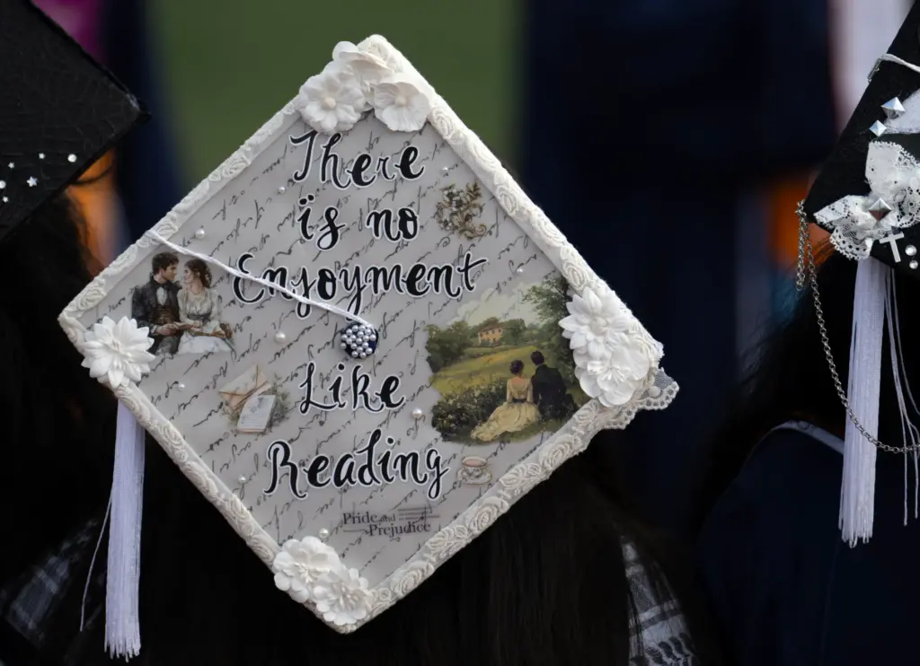 Perhaps this grad can enjoy more reading time after commencement...