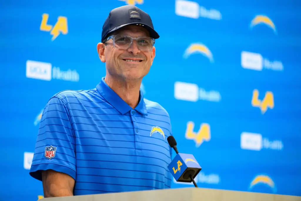 Chargers head coach Jim Harbaugh speaks to reporters before the...