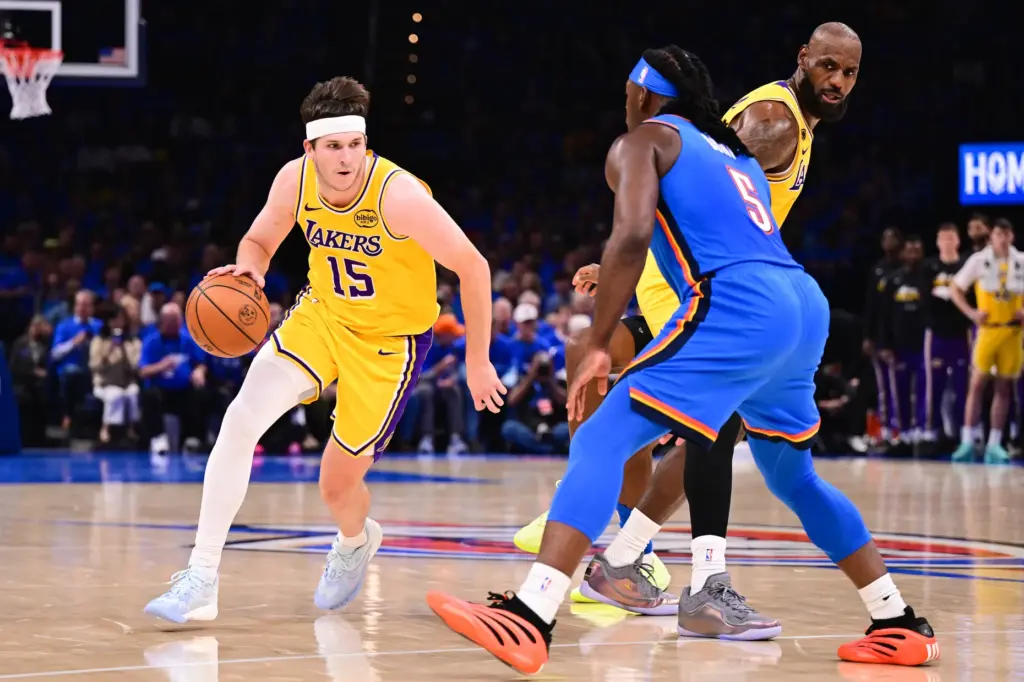 Lakers guard Austin Reaves drives as the Oklahoma City Thunder’s...