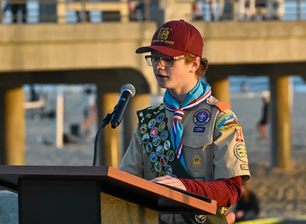 Lukas Kiltz, from Boy Scout Troop 1, delivers a youth...