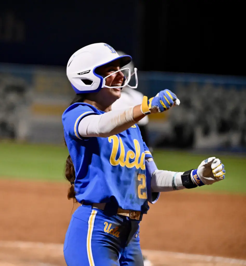 Aleena Garcia #21 of the UCLA Bruins reacts after hitting...