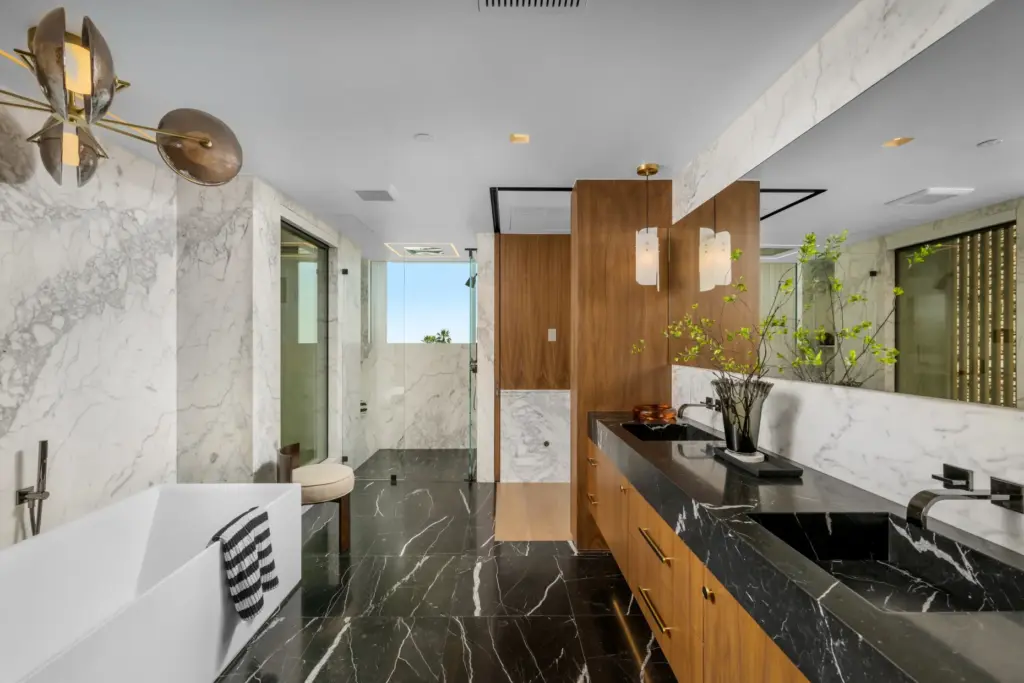A steam shower with window views, center, serves as the...