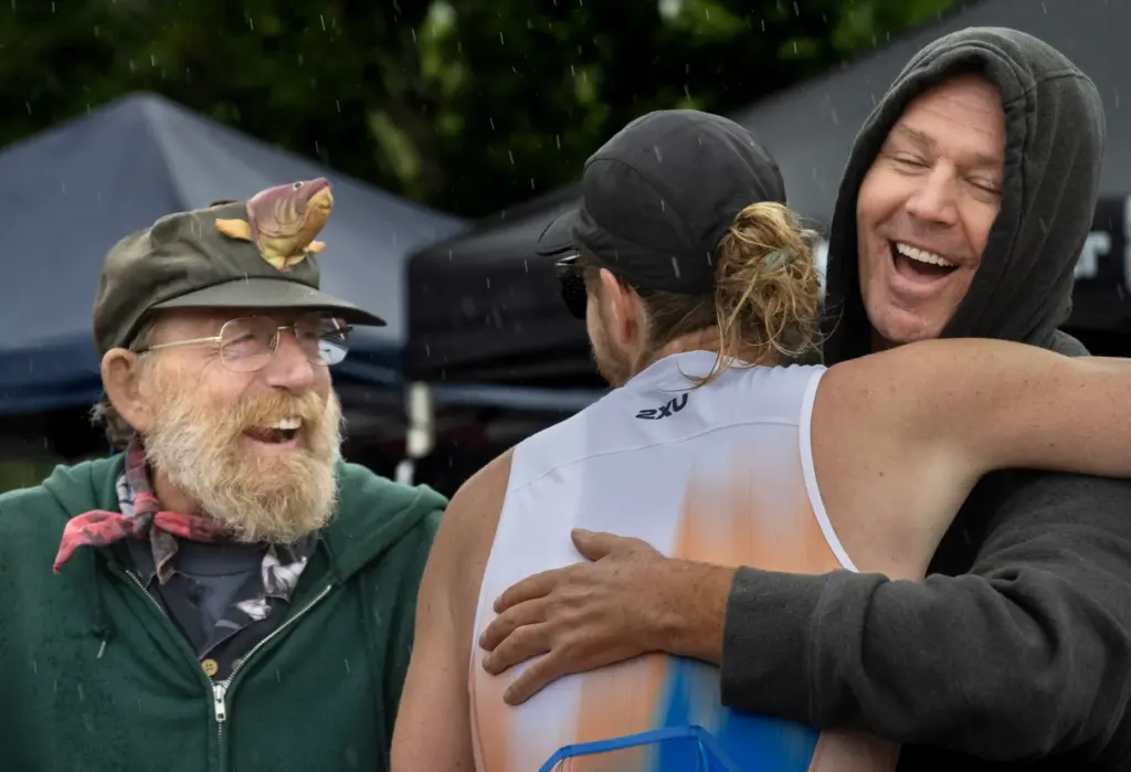 Sam Edman is congratulated at the finish line of the...
