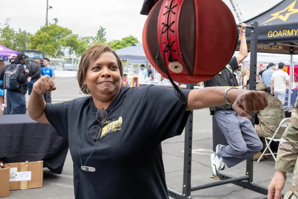 Carolyn Surratt of Texas tests her punching power during day...