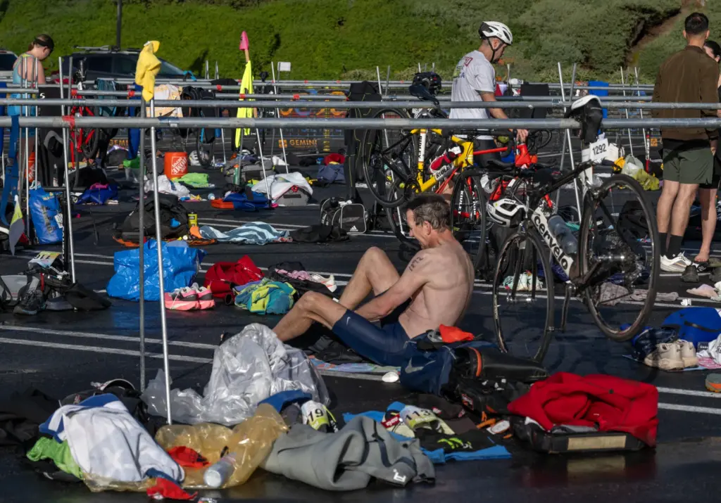 Athletes make a quick change from their swimming clothes to...