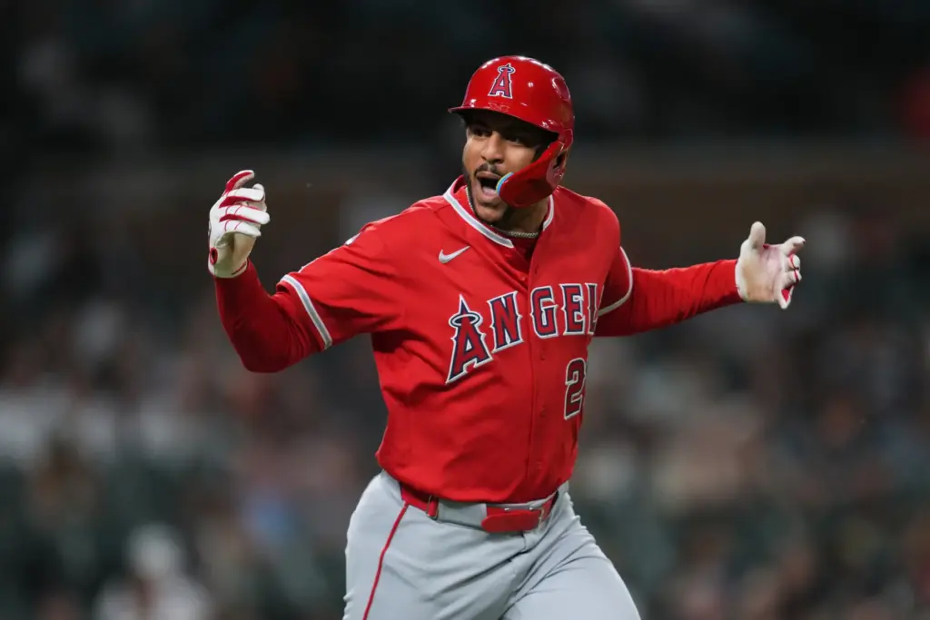 The Angels’ Jose Siri reacts as he begins to run...