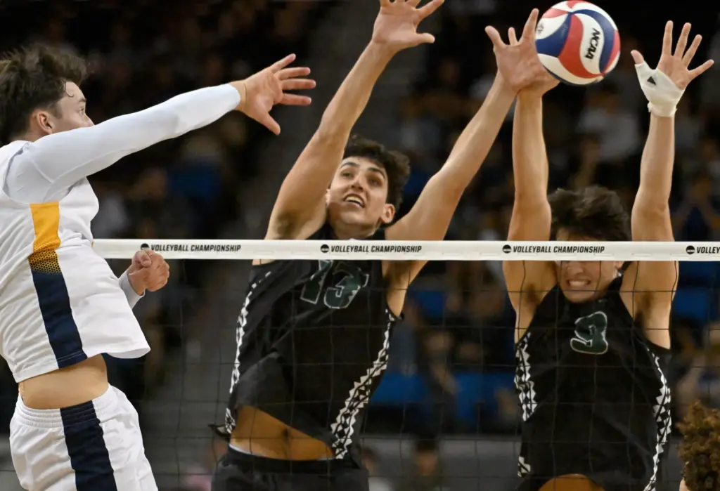 UC Irvineâs Andrej Jokanovic, left, hits against a block by...