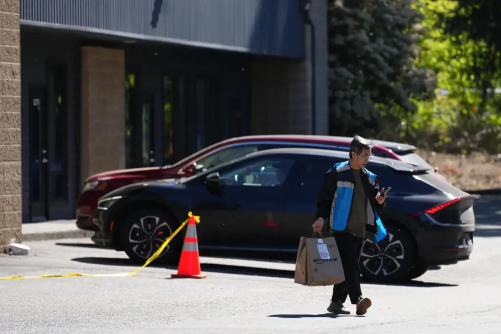 A driver picks up an order at an Amazon Now location.
