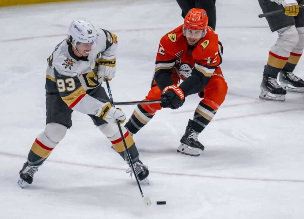 The Vegas Golden Knightsâ Mitch Marner, left, controls the puck...