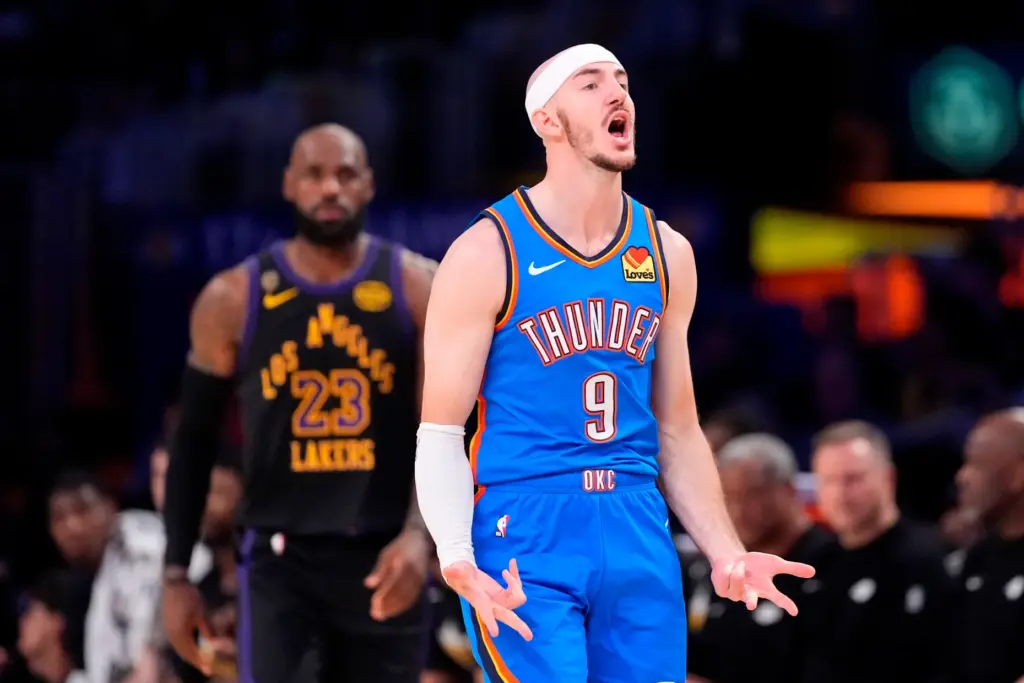 Oklahoma City Thunder guard Alex Caruso, celebrates after scoring as...